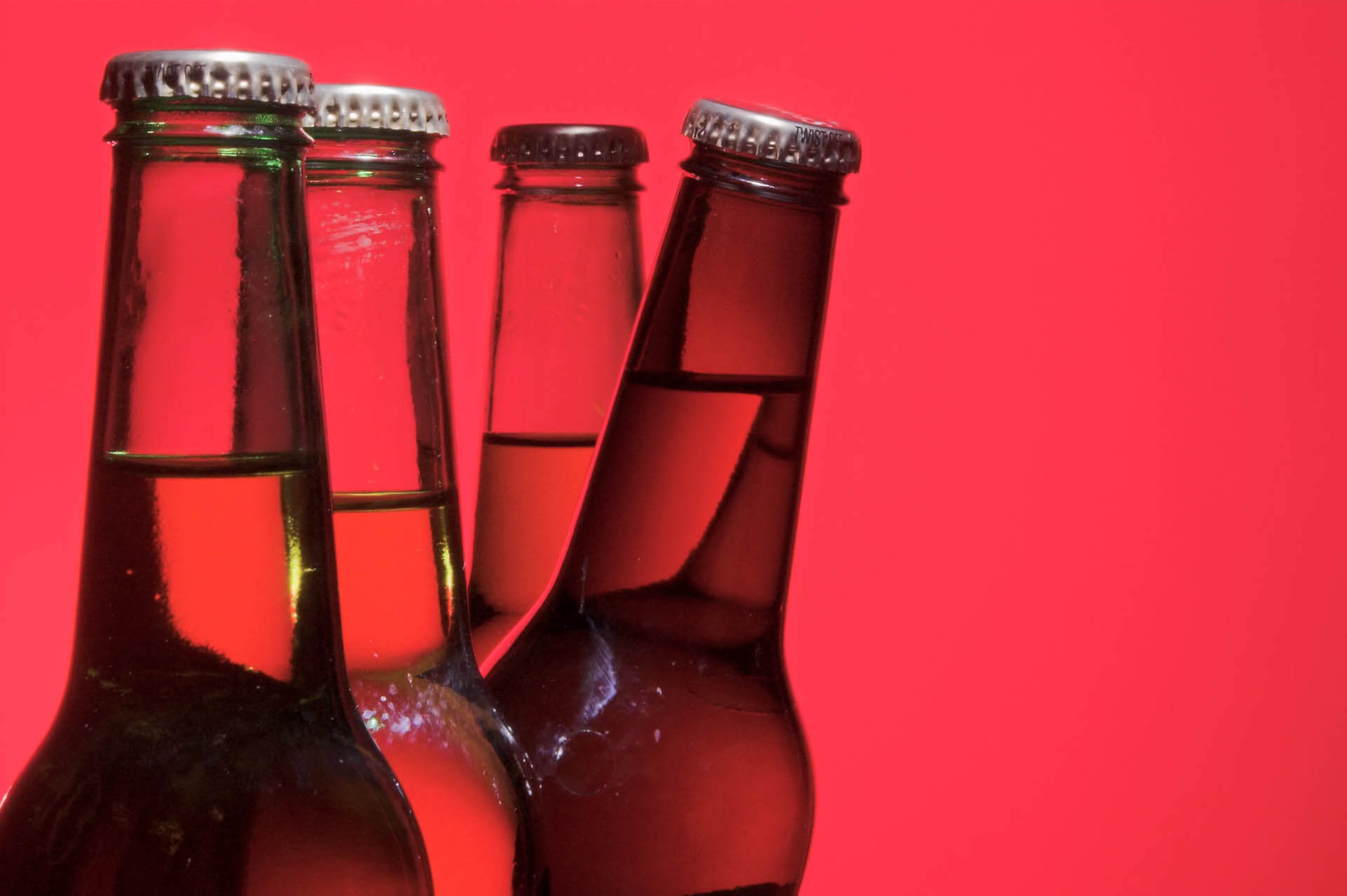 Abstract beer bottles on red background