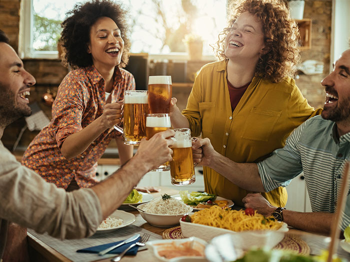 People drinking beer at a dining table