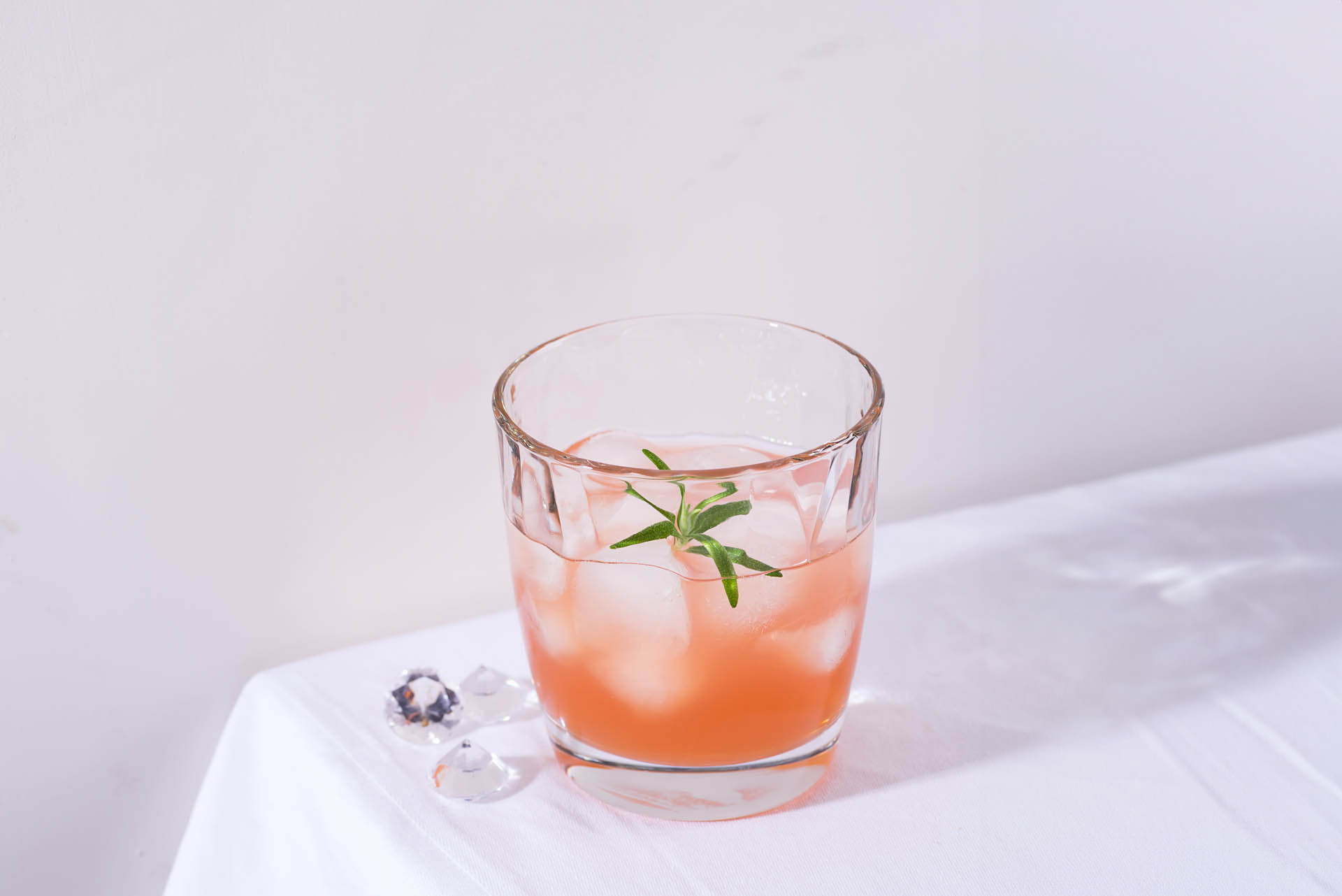 Pink cocktail on table cropped