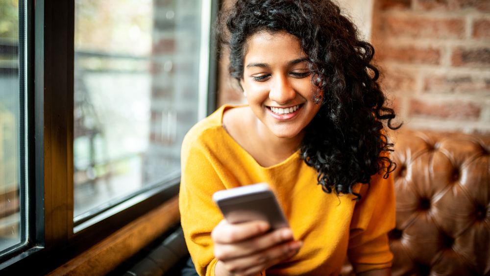 Woman with mobile phone in hand